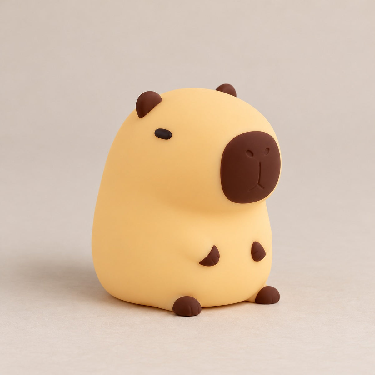 Capybara-lampa i mjuk silikon, släckt, mot ljus bakgrund